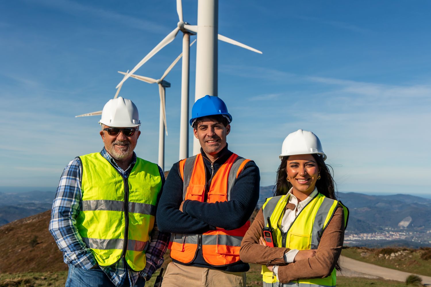 engineers in front of windmills